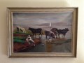 Vacas en la orilla y aguas del Lago